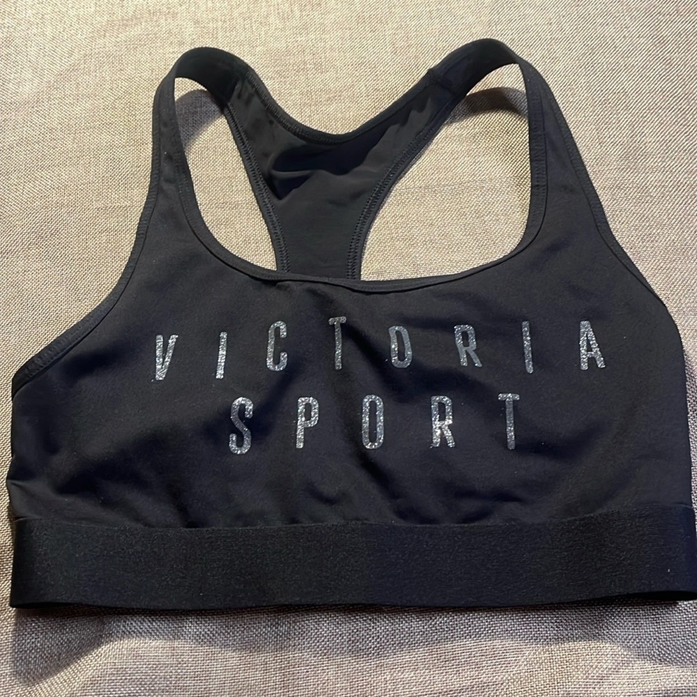 2/$30 Victoria’s Secret black sports bra with silver glitter letters, size XL.